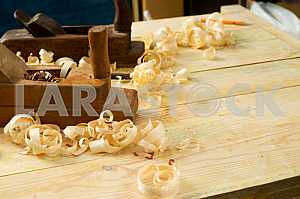 Carpenter tools on wooden table with sawdust. Circular Saw.