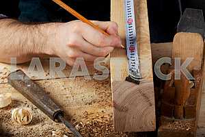 Carpenter tools on wooden table with sawdust. Circular Saw.