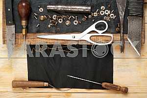 Carpenter tools on wooden table with sawdust. Circular Saw.
