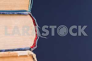 Stack of hardback books on wooden table. Back to school. Copy space