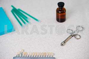 Stomatological instrument in the dentists clinic. Operation, tooth replacement.
