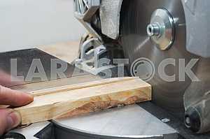 Carpenter tools on wooden table with sawdust. Circular Saw.