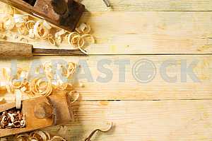 Carpenter tools on wooden table with sawdust. Circular Saw.