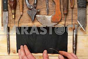 Carpenter tools on wooden table with sawdust. Circular Saw.