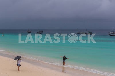 Holidaymakers and fishing boats