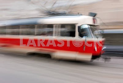 Red trolley car in the city