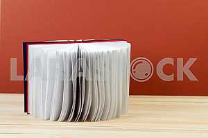 Stack of hardback books on wooden table. Back to school. Copy space