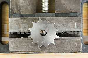 Different construction tools on a wooden background - screwdriver, caliper.