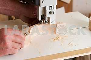 Carpenter tools on wooden table with sawdust. Circular Saw. Carpenter workplace top view