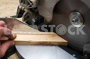 Carpenter tools on wooden table with sawdust. Circular Saw.
