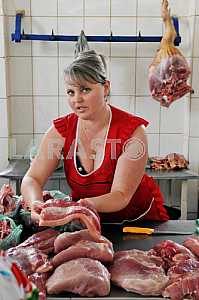 A woman sells meat on the market "Privoz" July 5, 2012