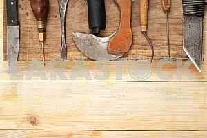Carpenter tools on wooden table with sawdust. Circular Saw.
