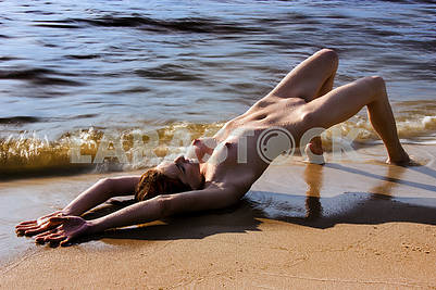 naked girl on the riverbank