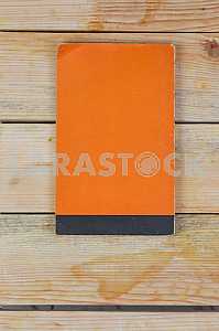 Open book, stack of hardback books on wooden table. Back to school. Copy space
