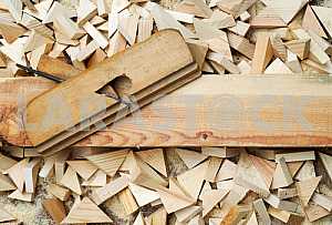 Different construction tools on a wooden background - screwdriver, caliper.