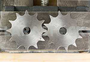 Different construction tools on a wooden background - screwdriver, caliper.