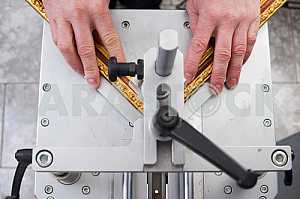 Carpenter tools on wooden table with sawdust. Circular Saw.