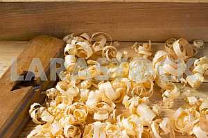 Carpenter tools on wooden table with sawdust. Circular Saw.