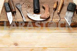 Carpenter tools on wooden table with sawdust. Circular Saw.