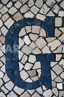 Portuguese sidewalk of calcada in the form of the letter G