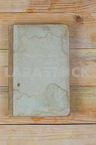 Open book, stack of hardback books on wooden table. Back to school. Copy space