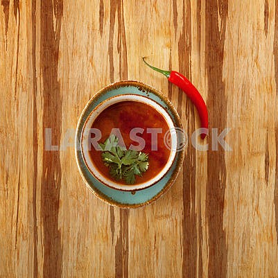 moroccan food, tomatoe soup dish decorated with parsley, on a pl
