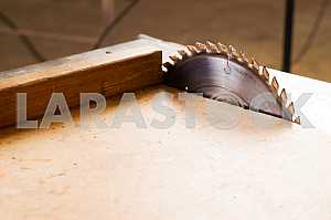 Carpenter tools on wooden table with sawdust. Circular Saw. Carpenter workplace top view