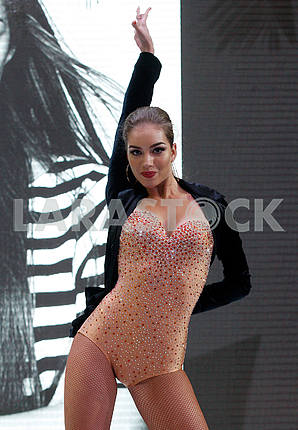 Alexandra Kucherenko with raised hand during dance