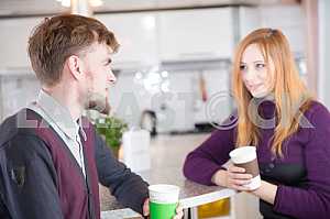 Young happy couple drinking tea in the morning