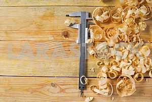 Carpenter tools on wooden table with sawdust. Circular Saw.