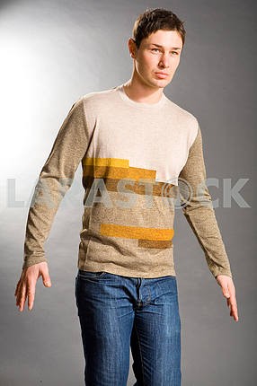 Young men dressed in sweater and jeans