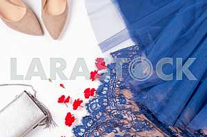 Woman clothes and accessories. Soft blue colors female apparel.