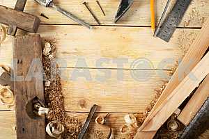 Carpenter tools on wooden table with sawdust. Circular Saw.