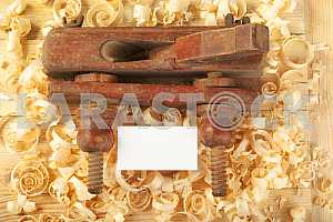 Carpenter tools on wooden table with sawdust. Circular Saw.