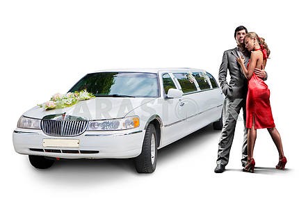 Young beautiful couple with their wedding limousine 