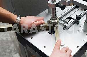Different construction tools on a wooden background - screwdriver, caliper.
