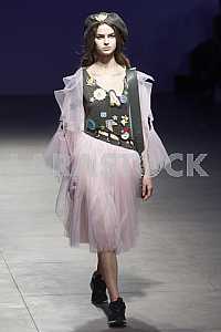 The model demonstrates outfit by Ukrainian designer Sofia Rousinovich