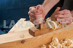 Carpenter tools on wooden table with sawdust. Circular Saw.