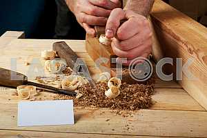 Carpenter tools on wooden table with sawdust. Circular Saw.