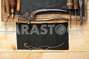 Carpenter tools on wooden table with sawdust. Circular Saw.