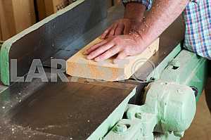 Carpenter tools on wooden table with sawdust. Circular Saw. Carpenter workplace top view