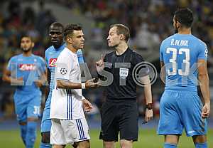 The referee (2r) and players during a game Dynamo (Kyiv) - Napoli (Naples)