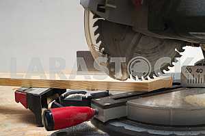 Carpenter tools on wooden table with sawdust. Circular Saw.