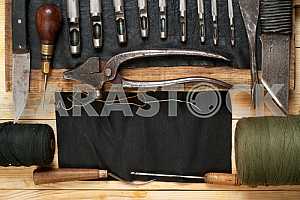 Carpenter tools on wooden table with sawdust. Circular Saw.